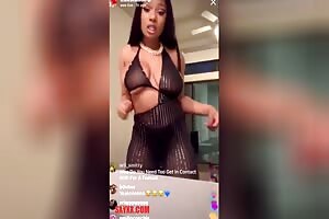 Megan Thee Stallion pulling out her pretty tit and exposing that chocolate nipple